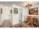 Small dining area with wooden table and access to kitchen at 665 Park Cir # 58, Bradenton, FL 34207