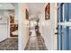 Bright entryway with patterned tile floor and view to living room at 665 Park Cir # 58, Bradenton, FL 34207