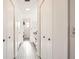 Hallway with tiled floors, built-in closets and access to bathroom at 665 Park Cir # 58, Bradenton, FL 34207