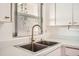 Modern kitchen sink with gold faucet and large window at 665 Park Cir # 58, Bradenton, FL 34207