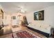 Living room boasts hardwood floors, a Christmas tree and access to the kitchen at 665 Park Cir # 58, Bradenton, FL 34207