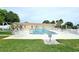 Inviting community pool and lounge chairs at 665 Park Cir # 58, Bradenton, FL 34207