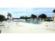 Relaxing community pool area with patio furniture at 665 Park Cir # 58, Bradenton, FL 34207