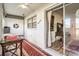 Bright sunroom with sliding glass doors, wood flooring, and built-in shelving at 665 Park Cir # 58, Bradenton, FL 34207