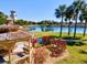 Charming gazebo overlooking a peaceful lake in a lush landscape at 6870 Willowshire Way, Bradenton, FL 34212