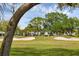 Golf course with players on the putting green at 7732 Palm Aire Ln, Sarasota, FL 34243