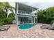 Two-story home with private pool and lush landscaping at 796 Jacaranda Rd, Anna Maria, FL 34216