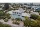 Ocean view of teal house and neighborhood at 796 Jacaranda Rd, Anna Maria, FL 34216