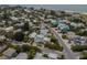 Aerial view of teal home and surrounding houses at 796 Jacaranda Rd, Anna Maria, FL 34216
