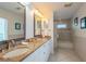 Double vanity bathroom with granite countertop and tiled floors at 796 Jacaranda Rd, Anna Maria, FL 34216