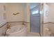 Relaxing bathroom with a large garden tub and a separate shower at 796 Jacaranda Rd, Anna Maria, FL 34216