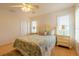 Bedroom with light-toned wooden furniture and seashell bedding at 796 Jacaranda Rd, Anna Maria, FL 34216