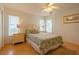 Bedroom with light-toned wooden furniture and seashell bedding at 796 Jacaranda Rd, Anna Maria, FL 34216