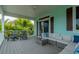 Spacious deck with comfortable seating and tropical views at 796 Jacaranda Rd, Anna Maria, FL 34216