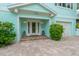 Front entrance with decorative door and landscaping at 796 Jacaranda Rd, Anna Maria, FL 34216
