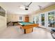 Game room with pool table and access to backyard at 796 Jacaranda Rd, Anna Maria, FL 34216