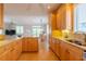 Open kitchen boasting granite countertops and ample wood cabinetry at 796 Jacaranda Rd, Anna Maria, FL 34216