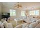 Spacious living room with sectional sofa and dining area at 796 Jacaranda Rd, Anna Maria, FL 34216