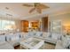 Spacious living room with sectional sofa and large TV at 796 Jacaranda Rd, Anna Maria, FL 34216