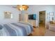 Comfortable Primary bedroom with striped bedding and a large walk-in closet at 796 Jacaranda Rd, Anna Maria, FL 34216