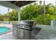 Stainless steel grill and granite countertops highlight this outdoor kitchen at 796 Jacaranda Rd, Anna Maria, FL 34216