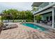 Stunning pool and patio area with plenty of lounge chairs at 796 Jacaranda Rd, Anna Maria, FL 34216