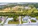 Home's aerial view showing proximity to park and trails at 801 Church St, Nokomis, FL 34275