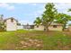 Large backyard with mature trees and shed at 801 Church St, Nokomis, FL 34275