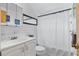 Clean bathroom with white vanity, shower, and tiled walls at 801 Church St, Nokomis, FL 34275