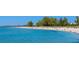 Expansive beach with clear water and people at 801 Church St, Nokomis, FL 34275