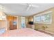 Large bedroom with king bed, dresser, and access to bathroom at 801 Church St, Nokomis, FL 34275