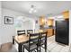 Kitchen with light wood cabinets and black and white tile at 801 Church St, Nokomis, FL 34275