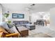 Living room featuring a sectional sofa and dining area at 801 Church St, Nokomis, FL 34275