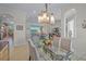 Open dining room with a view into the living room and kitchen at 8313 Barton Farms Blvd, Sarasota, FL 34240