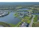 Aerial view of community, highlighting lake and homes at 8358 Redonda Loop, Bradenton, FL 34202