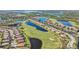 Aerial view of community, highlighting location near water and golf at 8402 Grand Estuary Trl # 104, Bradenton, FL 34212