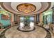 Elegant lobby with high ceilings and circular seating at 8402 Grand Estuary Trl # 104, Bradenton, FL 34212