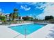 Community pool with plenty of lounge chairs for sunbathing at 9620 Club South Cir # 5209, Sarasota, FL 34238