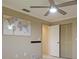 Bedroom with world map and ceiling fan at 103 Raphael Pl, Nokomis, FL 34275