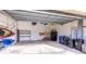 Garage with kayaks, shelves, and storage space at 103 Raphael Pl, Nokomis, FL 34275