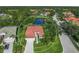 Aerial view showcasing house's location within a neighborhood, near a lake at 1109 Scherer Way, Osprey, FL 34229