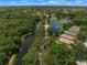 Community overview showing homes, ponds, and lush landscaping at 1109 Scherer Way, Osprey, FL 34229