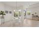 Bright breakfast nook with white table and chairs, pool view at 1109 Scherer Way, Osprey, FL 34229