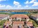 Aerial view of a luxurious condo community with a lake and golf course at 13725 Messina Loop # 104, Bradenton, FL 34211