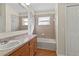 Bathroom with tub, shower, and wood flooring at 15230 Searobbin Dr, Lakewood Ranch, FL 34202
