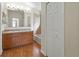 Clean bathroom with wood floor, tub, and double vanity at 15230 Searobbin Dr, Lakewood Ranch, FL 34202