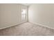Simple bedroom with carpeted floor and neutral walls at 15230 Searobbin Dr, Lakewood Ranch, FL 34202