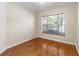 Bright bedroom with wood floors and large window at 15230 Searobbin Dr, Lakewood Ranch, FL 34202