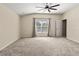 Large bedroom with carpeted floors and ceiling fan at 15230 Searobbin Dr, Lakewood Ranch, FL 34202