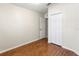 Spacious bedroom featuring wood floors and double door closet at 15230 Searobbin Dr, Lakewood Ranch, FL 34202